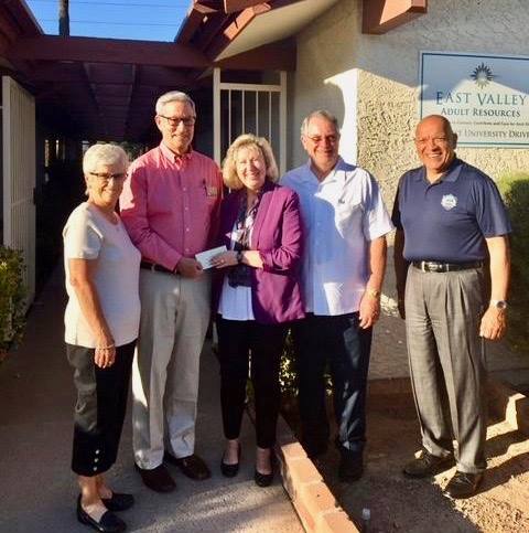 HoHoKam, Bob White presenting a check to Deborah Schaus CEO and other members of the Executive Committee of the East Valley Adult Resources