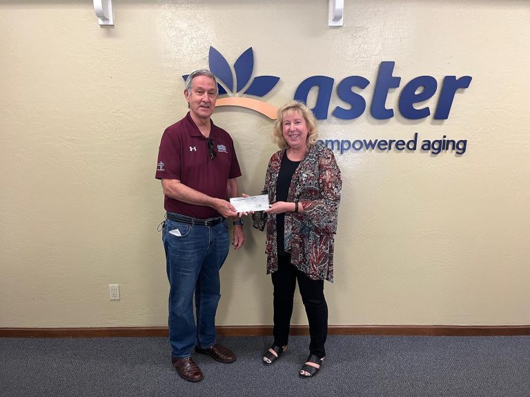 HoHoKam Member, Bob White presented a check Grant Award Check to Deborah Schaus, CEO of Aster Aging, Inc.