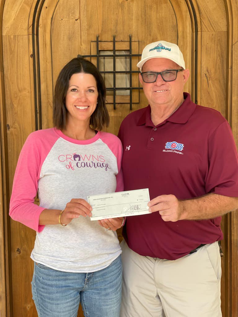 HoHoKam Member Mark Grant presents a check from from 50:50 Raffle Cub’s:Athletics HoHoKam Spring Training 2022, to Crowns of Courage- Jessica A. Rinehart Vice President and CO-founder.