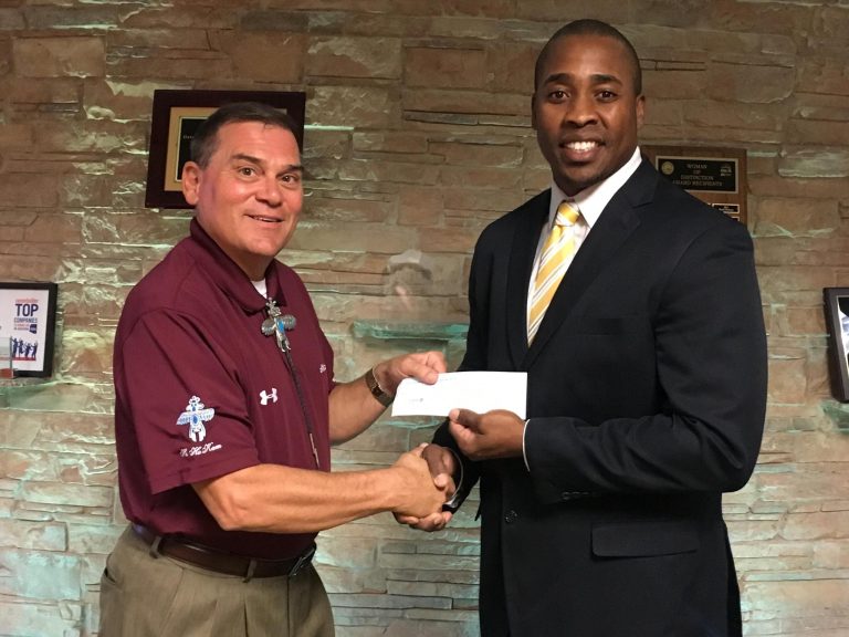 HoHokam, Gerald E. Paulus presents a check to Dr. LerodrickTerry, Chairman of the Board for College Bound