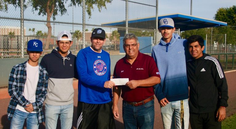 Mesa HoHoKam Hector Hernandez, presents a check, from the HoHoKam Foundation, to Westwood High School (Mesa, Arizona) Head Baseball coach, J.R. Langston
