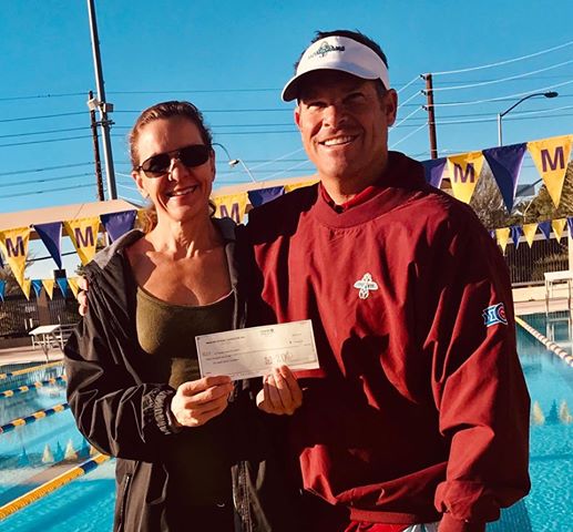 Mesa HoHoKam, Kent Nicholas presents a check, from the HoHoKam Foundation to Sandy Shrader Executive Director of The Arizona Aquatic Sports Foundation