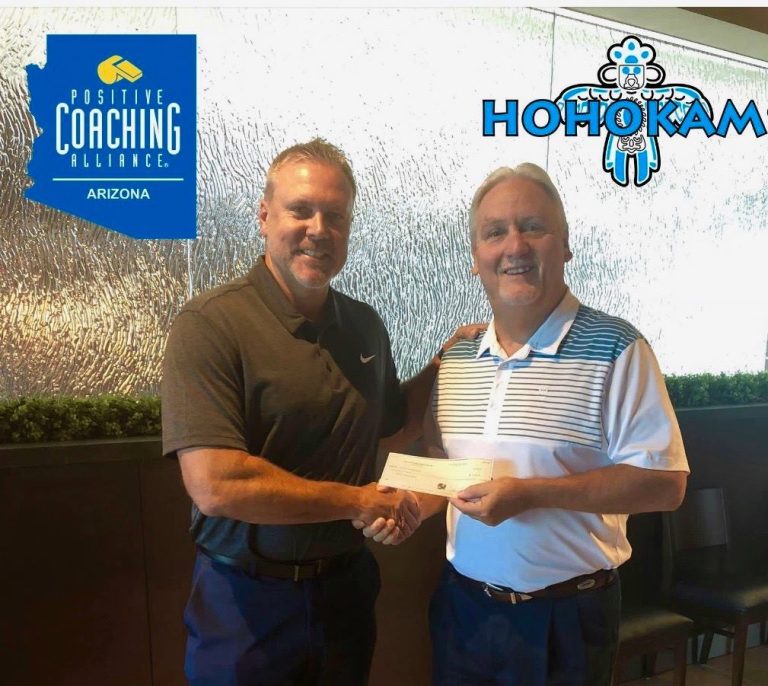 Mesa HoHoKam member, Paul Buser, presents a check to Positive Coaching Alliance-Arizona