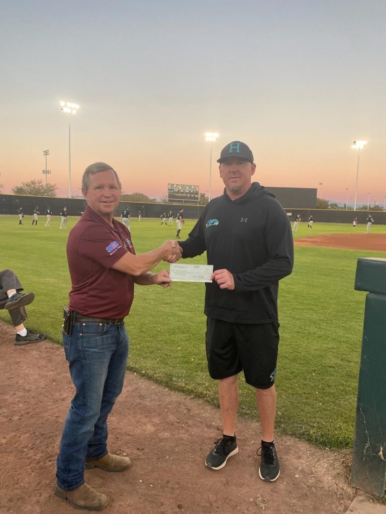 Mesa Hohokam, Bryan Vivian, presents a check from the Hohokam Foundation, to Highland High School Head Baseball Coach Erik Kehoe