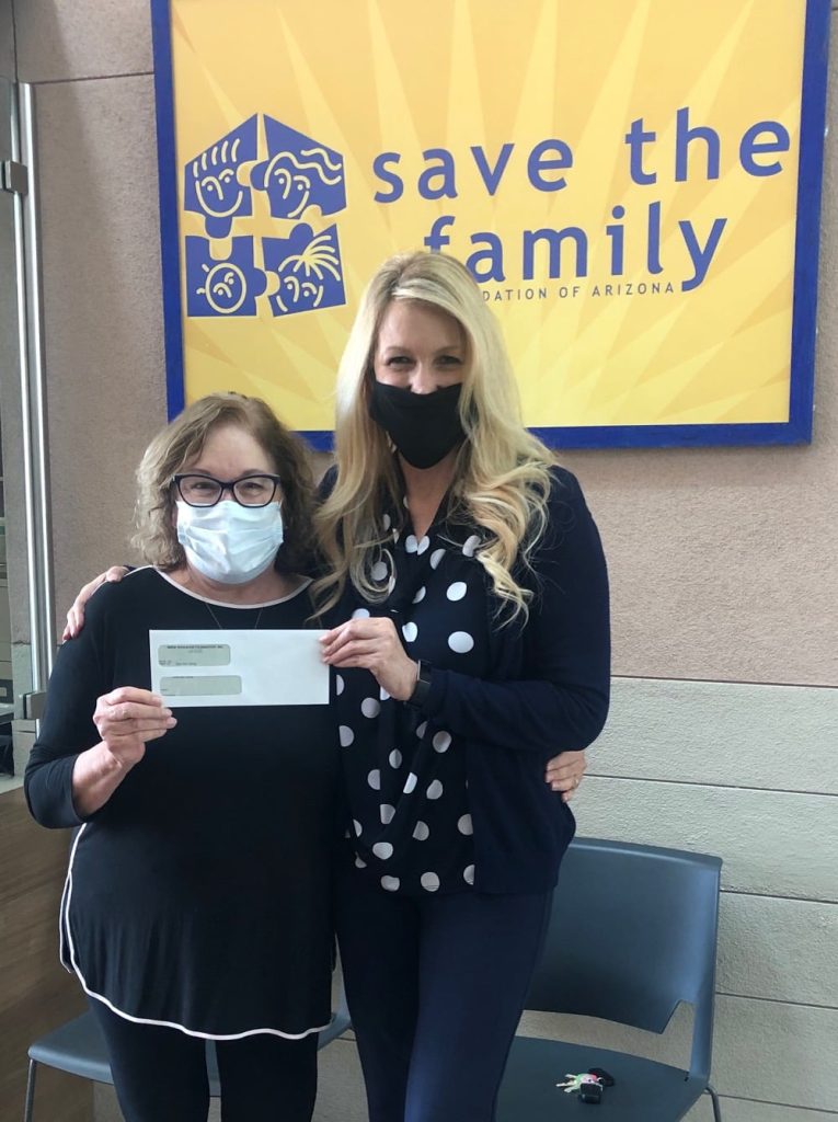 Mesa Hohokam, Sally Harrison, presented a check from the Hohokams, to Save the Family Foundation of Arizona CEO, Jacki Taylor.