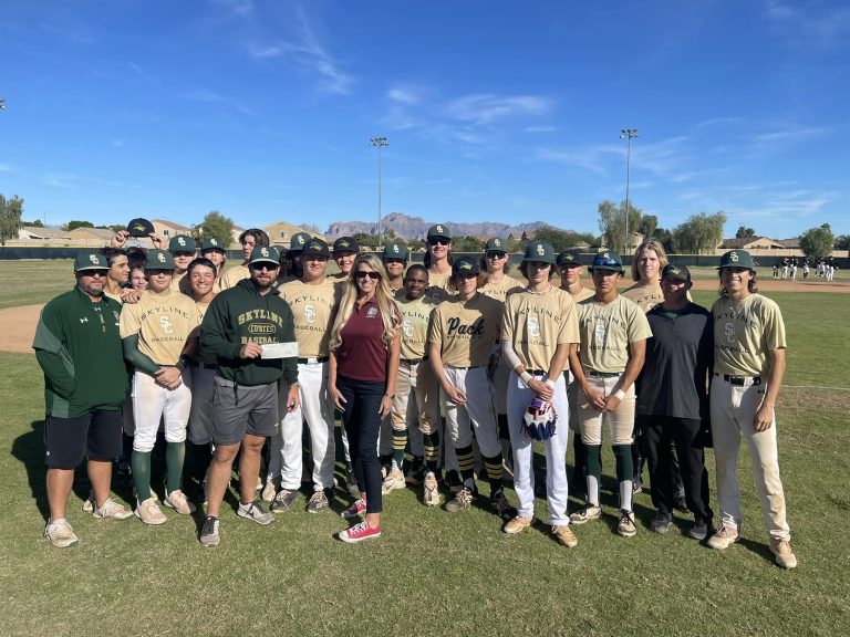 Mesa Hohokam member, Sally Harrison, presented a check to the Skyline Coyotes Baseball Booster Club to help them in purchasing new uniforms and equipment.