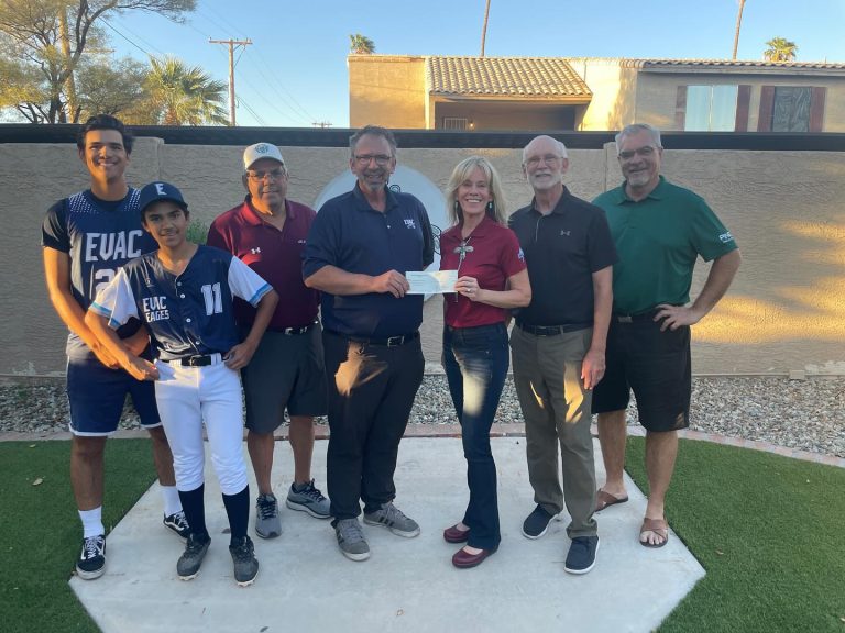 Mesa HoHoKam Shanlyn Newman presents Grant check for 59/50 Cubs//HoHoKam raffle proceeds to Patrick Mehan on behalf of East Valley Athletes for Christ.