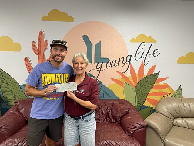 Mesa HoHoKam member, Sally Gatchel presenting Grant Check from 50-50 Cubs/HoHoKam raffle to Johnny Corcoran - area director for Tempe and Ahwatukee Young Life