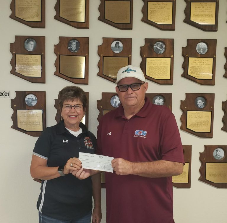 Presenting a check, Mark Grant, to: Beverlee Nielsen of the Mesa City Sports Hall of Fame.