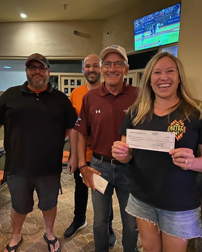 Mesa HoHoKam, Neil Barna presents Grant check from 50/50 Cubs/HoHoKam raffle to Scott Smith, Club Operations PJ Rovinelli High School Head Coach Kate Matsler, President - lacrosse league in Tempe.