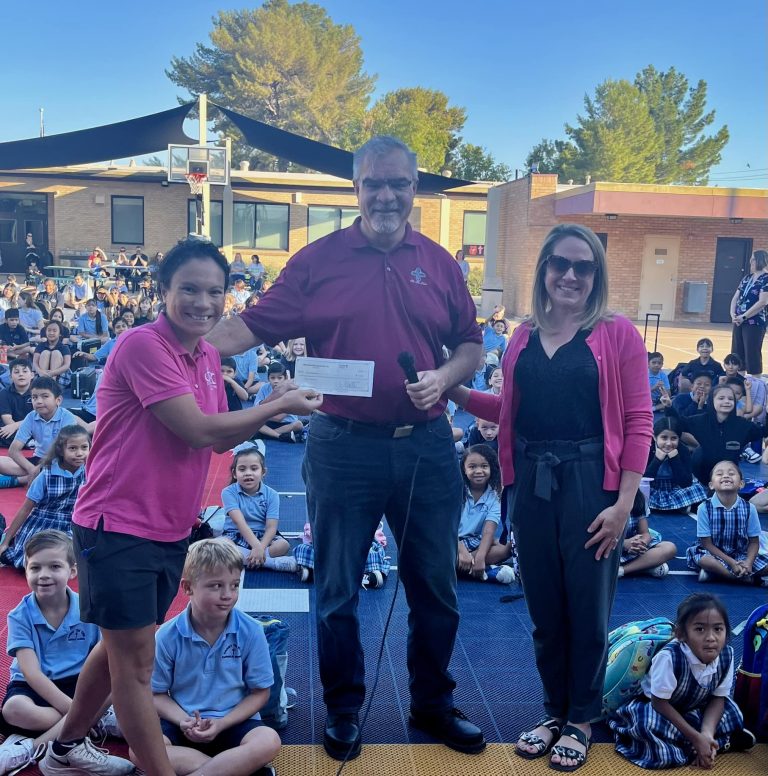 Check presentation from The Mesa Hohokams to Christ the King Catholic School for youth sports.