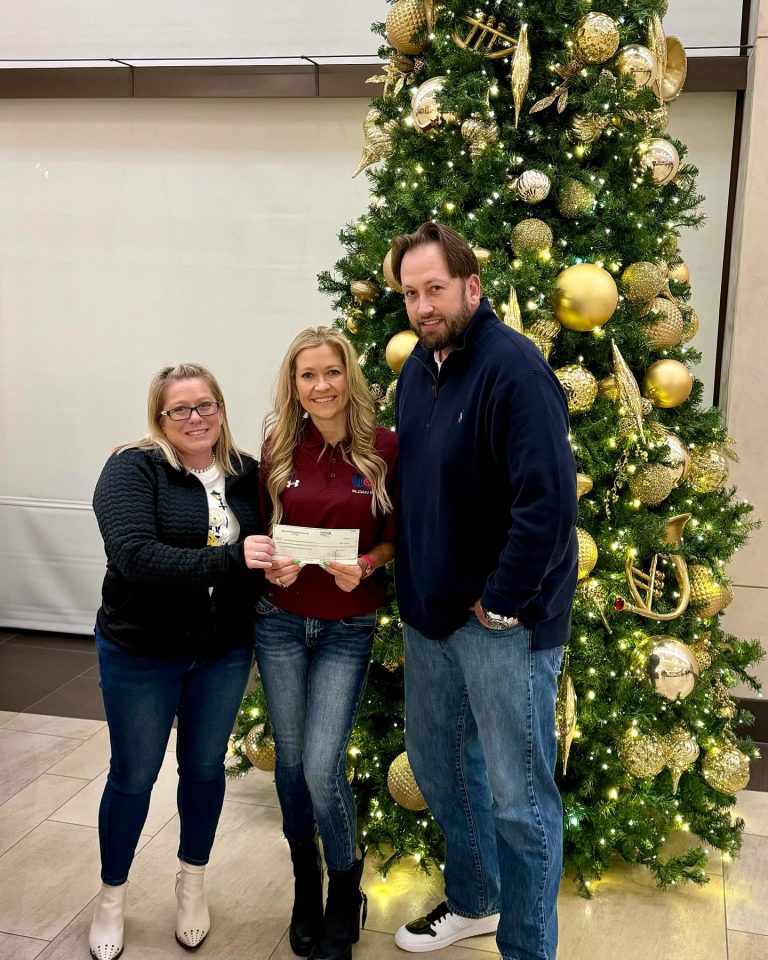 Mesa HoHoKam, Stephanie Siete presenting check to Christina Bolyard and Robert Bergman of Arizona Knowledge Empowerment and Advocacy Group.