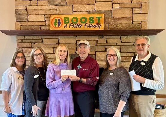 Mesa HoHoKam, Sal Flores, presented a grant from the 50/50 Raffle to Boost a Foster Family. From left to right:  Jennie Cook, Alice Burba, Michelle Noe, Sal Flores, Donna and John Olson.