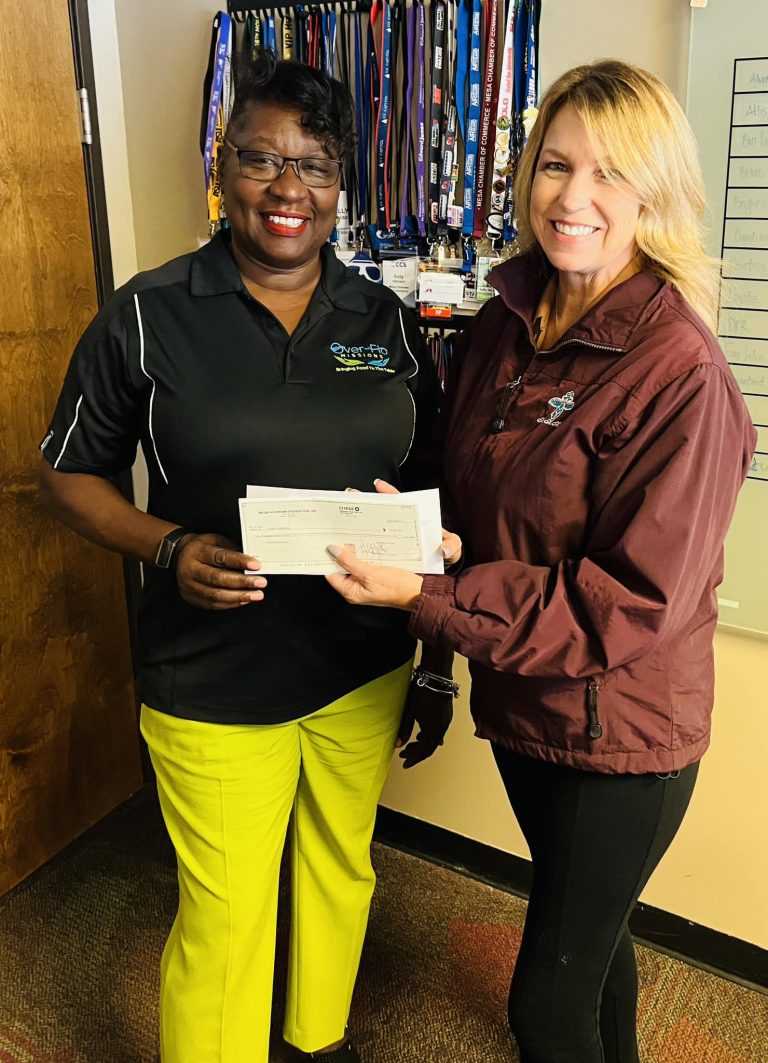 Mesa Hohokam member, Sally Jo Harrison, presented Denise Anderson Carter, with Over-Flo Missions Inc., with a grant check from this spring trainings 50/50 sales.