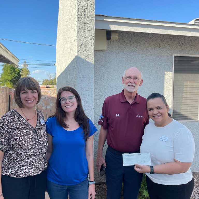 Mesa HoHoKam, Mark Fullerton presents a check to Laura Bode, Miquela Goodson and Kimberly Hubbard of the New Leaf Autumn House from the Mesa Hohokam 50/50 Grant Fund.