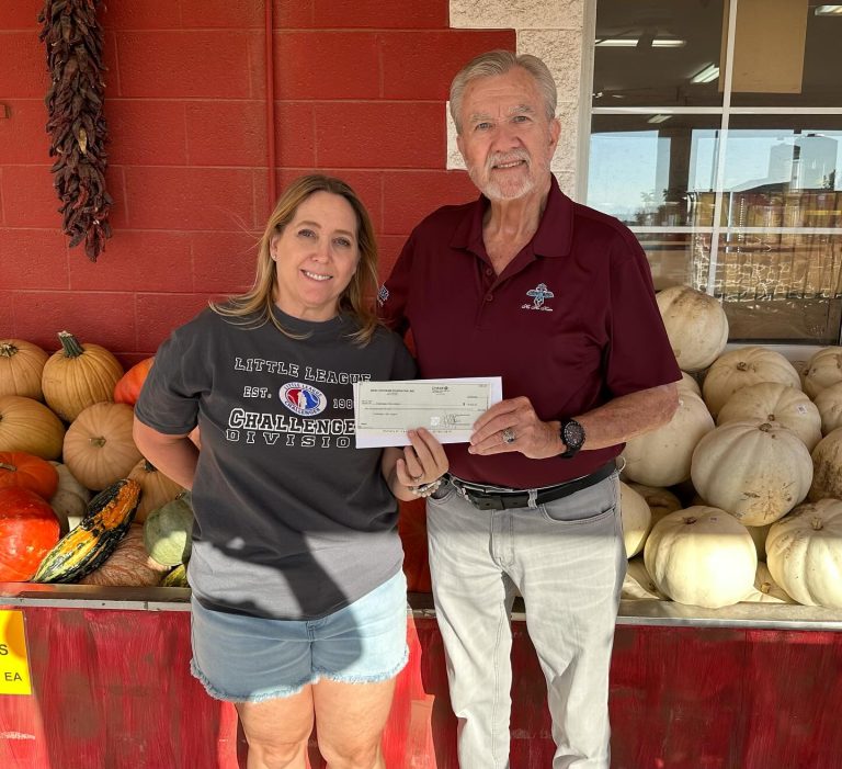 HoHoKam George Bliss presents Grant check to Denise DeLage for Challenger Little League.