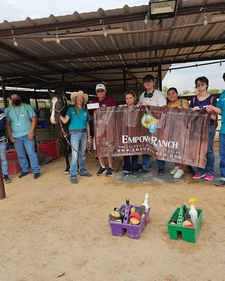 Mesa HoHoKam, Mark Grant presents a grant check to EmpoweRanch Executive Director: Jessica Voss.