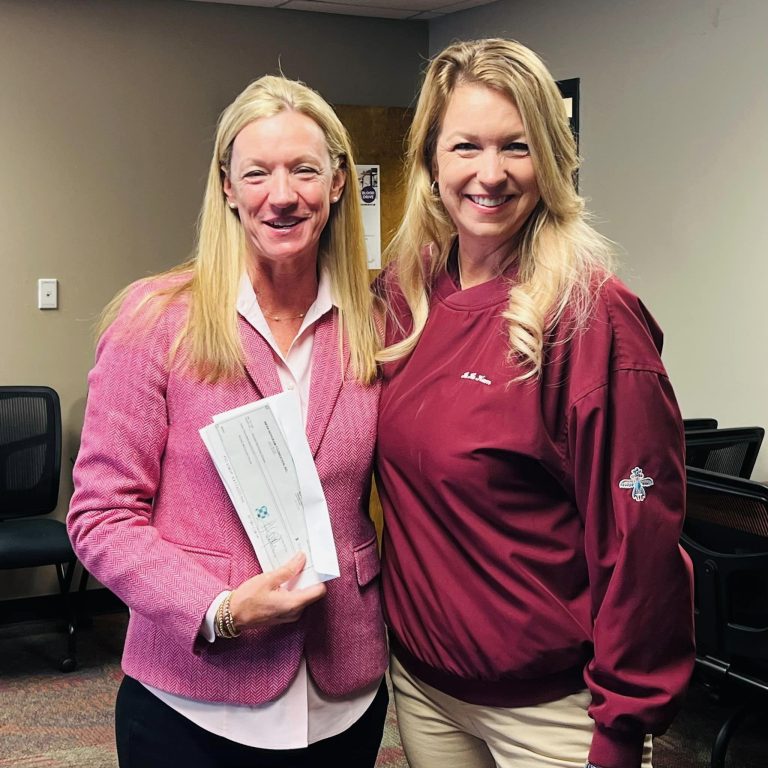 Hohokam member, Sally Jo Harrison, presented a grant check from 50/50 raffle sales to Ronald McDonald House Charities (RMHC) CEO, Kerry Schuman.