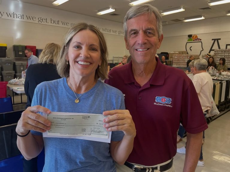 AZ Brain Food Mesa HoHoKam Tim Baughman presented a 50/50 grant to AZ Brain Food CEO Ruth Collins. The organization provides weekend food backpacks to local schoolchildren experiencing food insecurity.