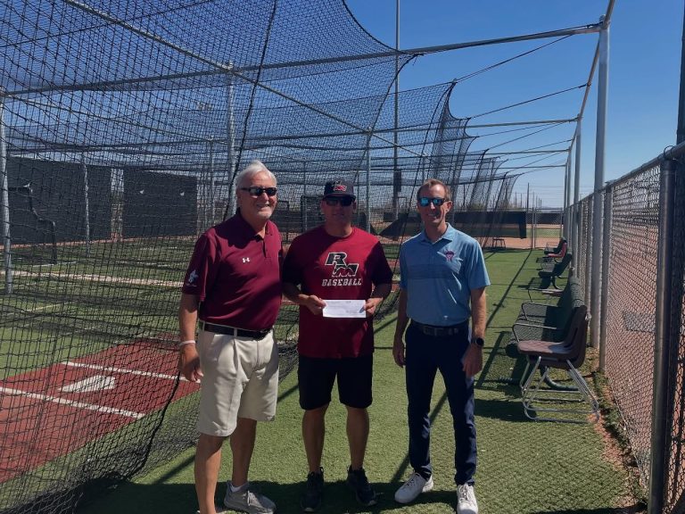 Red Mountain High School Baseball Mesa HoHoKam Foundation Trustee Paul Buser and Chicago Cubs Spring Training VP/GM Justin Piper presented grant support to Red Mountain Baseball JV Coach Jared Gabel. The funds will help provide new batting cages for the program.