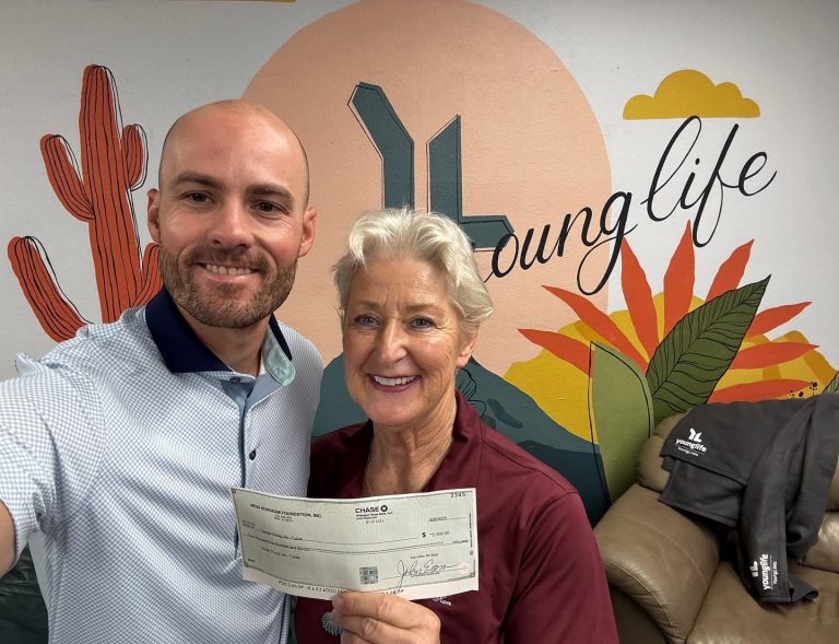 Tempe Young Life Mesa HoHoKam Sally Gatchel presented a grant to Johnny Corcoran, Young Life Director for Tempe and Ahwatukee. The funds help provide transportation for local youth to attend camp.