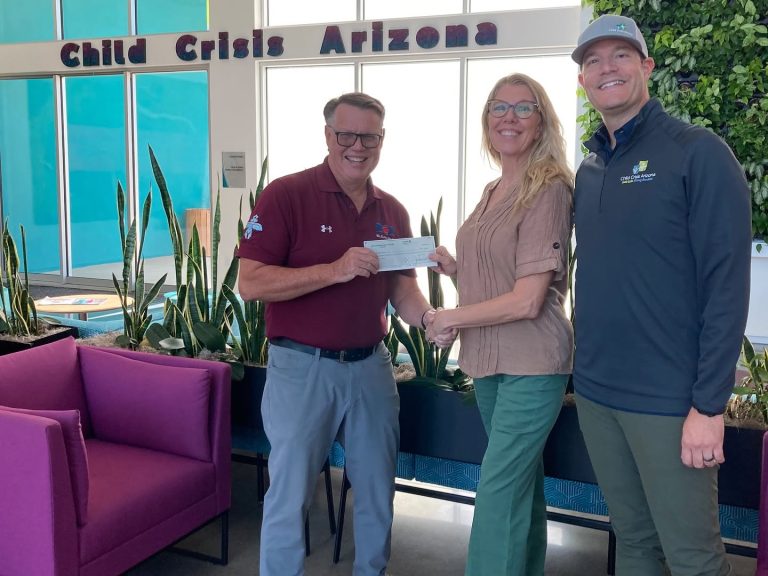 Child Crisis Arizona Mesa HoHoKam Steve Adams presented a 50/50 Raffle Grant to Child Crisis Arizona CEO Torrie Taj and VP of Development Justin Duran. The funds support youth receiving care through the organization’s residential programs.